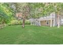 A spacious backyard with lush lawn and deck with stairs, perfect for outdoor enjoyment at 5 Tiara Ln., Murrells Inlet, SC 29576