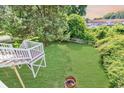 An expansive backyard with a deck, lush lawn, and white picket fence, ideal for recreation at 5 Tiara Ln., Murrells Inlet, SC 29576