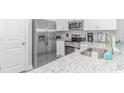 Kitchen features stainless steel appliances and granite countertops, offering a modern look at 505 Chester St 5Th Ave. N, Myrtle Beach, SC 29577