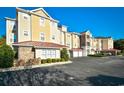 Multi-Gathering building with yellow siding, brown trim and parking in front at 5650 Barefoot Resort Bridge Rd. # 431, North Myrtle Beach, SC 29582