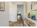 Open entryway with hardwood floors, stylish decor, and seamless transition to the living spaces at 5716 Lombardia Circle, Myrtle Beach, SC 29579