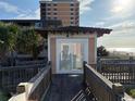 Charming beachfront property with a wooden walkway offering stunning ocean views and private beach access at 5732 N Ocean Blvd., Myrtle Beach, SC 29577