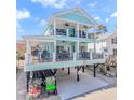 Gorgeous two-story home with balconies, lots of outdoor seating, and golf cart parking at 6001 - 1195 S Kings Hwy., Myrtle Beach, SC 29575