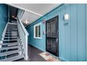 Building hallway with muted blue walls leading to unit #205 with easy access to the stairwell at 720 N Waccamaw Dr. # 205, Garden City Beach, SC 29576