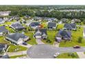 Beautiful aerial shot of a landscaped home in a friendly neighborhood with mature trees at 908 Ashbourn Ct., Murrells Inlet, SC 29576