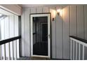 Apartment front door with a screen door for ventilation and natural light at 950 Forestbrook Rd. # B-8, Myrtle Beach, SC 29588