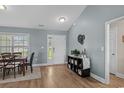 Welcoming entryway features a dining room table and storage at 1100 Rosetta Dr., Conway, SC 29526