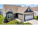 Attractive single-story home featuring neutral siding, well-kept lawn, and an attached garage at 1459 Villena Dr., Myrtle Beach, SC 29579