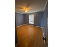 Cozy bedroom with neutral walls, hardwood floors, and a ceiling fan at 232 Weyburn St., Myrtle Beach, SC 29579