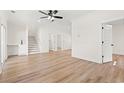 Spacious living room with hardwood floors and a staircase with white risers at 2426 Park St., North Myrtle Beach, SC 29582