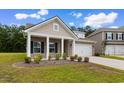 Charming single-story house featuring a landscaped front yard and a convenient two-car garage at 3217 Shadow Pine Ct., Myrtle Beach, SC 29579