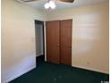 Bedroom features a standard closet, neutral paint, and green carpet at 4041 Long Line Ln., Myrtle Beach, SC 29579