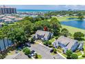 Stunning aerial view of coastal townhouses with golf course, lakes, and ocean views at 503 20Th Ave. N # 9D, North Myrtle Beach, SC 29582
