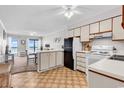 Bright kitchen seamlessly flows into the living area with a view of the balcony at 5601 N Ocean Blvd. # A309, Myrtle Beach, SC 29577