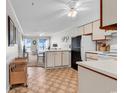 Bright and open living room with ocean view balcony, connected to the dining area at 5601 N Ocean Blvd. # A309, Myrtle Beach, SC 29577