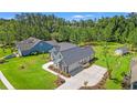 Aerial view of the property showcasing the home's layout, large yard, and surrounding neighborhood at 609 Mccown Dr., Conway, SC 29526