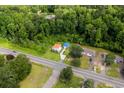 Aerial view of property showcasing the home's location and surrounding lush green landscape at 709 Highway 90, Conway, SC 29526