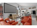 A bright living room featuring modern design and decor leading into the kitchen at 709 Highway 90, Conway, SC 29526
