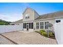 Spacious backyard with a paved patio, privacy fence, and well-maintained landscaping at 156 Parmelee Dr. # D, Murrells Inlet, SC 29576