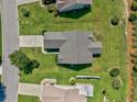 Aerial view showcasing the home's roof, lawn, driveway, and neighborhood at 219 Blackpepper Loop, Little River, SC 29566