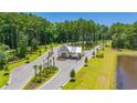 Aerial shot of the private community entrance surrounded by lush greenery and manicured landscaping at 2273 Hazel Way, Longs, SC 29568