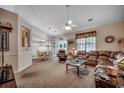 Spacious living room featuring a comfortable seating arrangement, ceiling fan, and neutral color palette at 2602 Clearwater St., Myrtle Beach, SC 29579