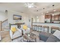 Open concept living room featuring modern decor, a comfortable seating area, and a view of the dining area at 2701 Kashton Dr., Myrtle Beach, SC 29577