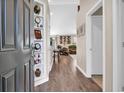 Inviting foyer with hardwood floors, recessed lighting, and built-in shelving for décor and storage at 3154 Shorecrest Bay Dr., Murrells Inlet, SC 29576