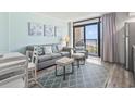 Living room with comfortable seating and an ocean view at 4800 S Ocean Blvd. # 520, North Myrtle Beach, SC 29582