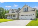 Well-maintained home with a spacious driveway and attached two-car garage for convenient parking at 5164 Water Breeze Ct., Myrtle Beach, SC 29588