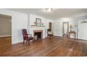 Bright living room with fireplace, hardwood floors, and views into other rooms at 602 3Rd Ave. N, Myrtle Beach, SC 29577