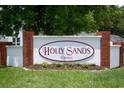 Attractive Holly Sands Estates community sign with brick accents and landscaping at 890 Holly Sands Blvd., Little River, SC 29566
