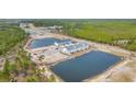 Aerial view of newly constructed neighborhood, complete with community ponds at Tbb Lineback Pl. # 32, Longs, SC 29568