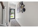 Inviting foyer featuring decorative wall art and a patterned rug, showcasing the home's stylish entrance at 1428 Lanterns Rest Rd. # 1428, Myrtle Beach, SC 29579