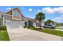 Scenic view of townhomes with well-maintained lawns, mature palm trees, and a peaceful residential street at 178 Parmalee Dr. # C, Murrells Inlet, SC 29576