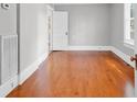 Bright bedroom with hardwood floors, light gray walls, and white trim at 203 Lakeland Dr., Conway, SC 29526