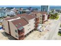 Beautiful aerial view showing patios and pool and the beach in the distance at 212 29Th Ave. N # 204, North Myrtle Beach, SC 29582
