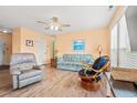 Inviting living room with laminate floors, ceiling fan, comfortable seating and bright, natural light at 212 29Th Ave. N # 204, North Myrtle Beach, SC 29582
