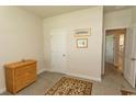 Neutral bedroom featuring a closet, dresser, and soft carpet at 435 Rollins Dr., Longs, SC 29568