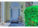 Inviting front entrance with decorative details and welcoming foliage at 4355 Rivergate Ln. # F, Little River, SC 29566