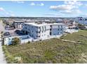 Aerial view of a condo building, showing its proximity to the beach and community pool at 5000 N Ocean Blvd. # E-2, North Myrtle Beach, SC 29582