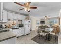 Open concept kitchen and living area features updated appliances, tile floors and plenty of light at 6301 N Ocean Blvd. # 2B, North Myrtle Beach, SC 29582
