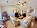 Bright living room featuring high ceilings, hardwood floors, and stylish furnishings at 706 Jamie Ln., Conway, SC 29526