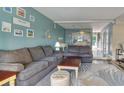 Cozy living room with stylish decor, comfortable seating, and a view into the dining area at 832 Villa Dr. # 832, North Myrtle Beach, SC 29582