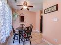 Cozy dining area with a round table, decorative ceiling fan, and inviting decor at 850 Fairway Dr. # 904Ee, Longs, SC 29568