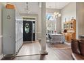 Welcoming foyer with tile floors, lockers, high ceilings, and a charming dining table set with a checkered cloth at 232 White Water Loop, Conway, SC 29526