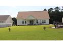 Spacious backyard featuring a well-manicured lawn, perfect for outdoor activities and relaxation at 242 Four Mile Rd., Conway, SC 29526