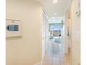 Hallway with tile flooring, white walls, and an ocean view visible from the end of the hall at 2501 S Ocean Blvd. # 503, Myrtle Beach, SC 29577