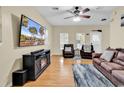 Comfortable living room featuring hardwood floors, ceiling fan, and plenty of natural light at 3969 Murrells Inlet Rd., Murrells Inlet, SC 29576