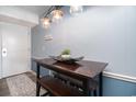 Cozy dining area features a wooden table, benches, and modern lighting at 5601 N Ocean Blvd. # E-113, Myrtle Beach, SC 29577